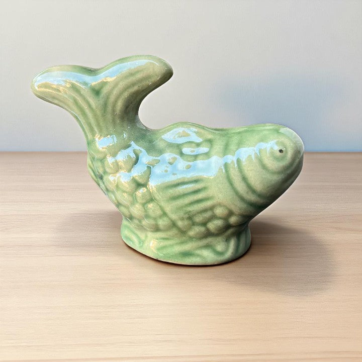 Small green fish miniature