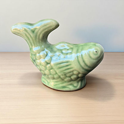 Small green fish miniature