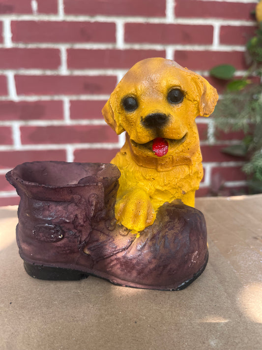 Charming big dog planter designed for holding succulents or indoor plants, featuring a playful yellow dog perched on a rustic boot. Perfect for adding personality and fun to your indoor garden setup. Discover unique and decorative succulent pots at Plant Orbit.