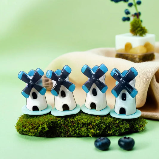 Charming windmill miniatures in white and blue, ideal for creating a whimsical touch in your miniature garden. These miniature garden accessories add a playful and decorative element, perfect for enhancing garden displays or toy collections. Discover unique miniature garden toys like these at Plant Orbit.